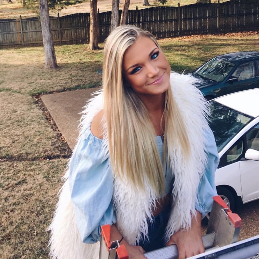 White fur vest